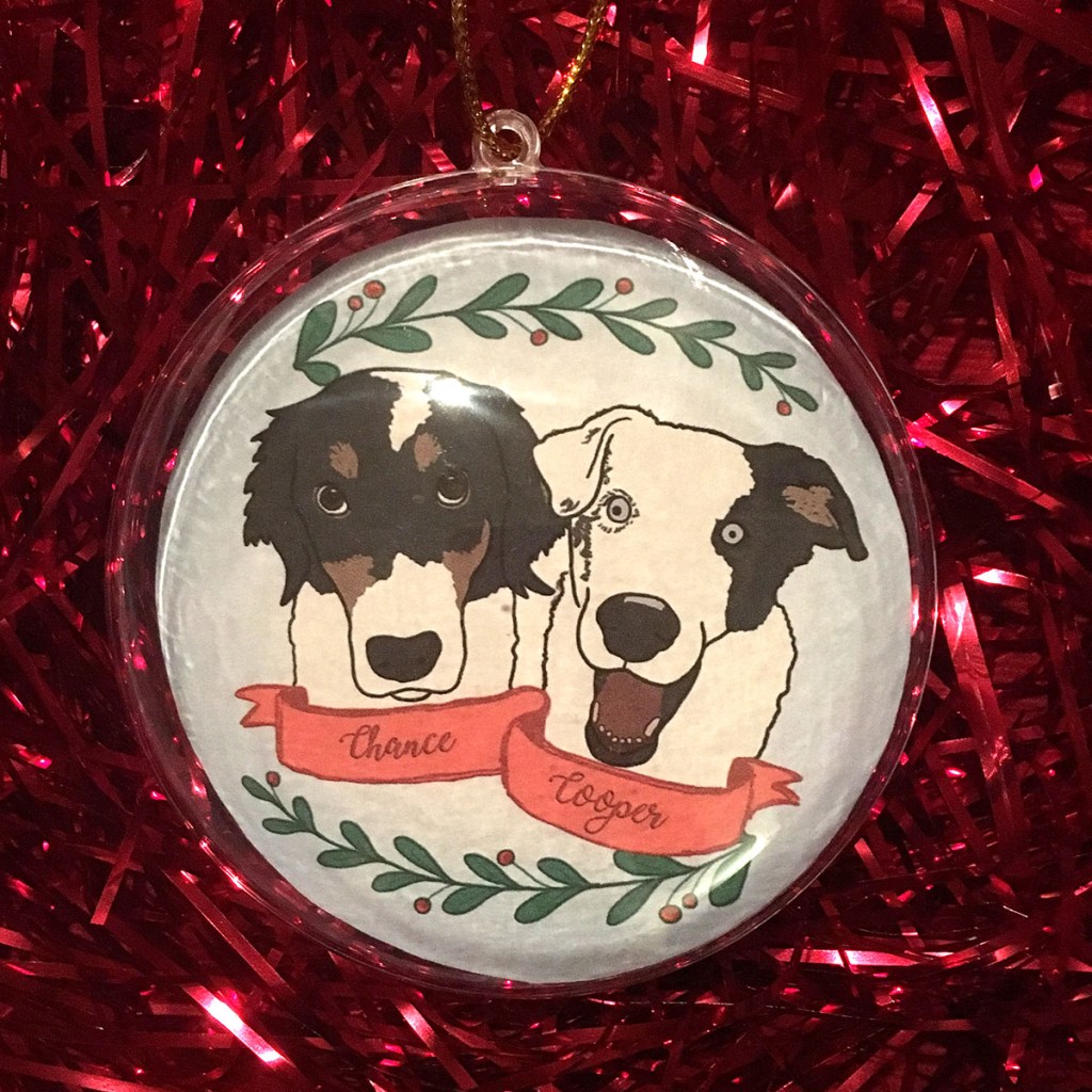 Holiday ornament with an illustrated portrait of two dogs named Chance and Cooper