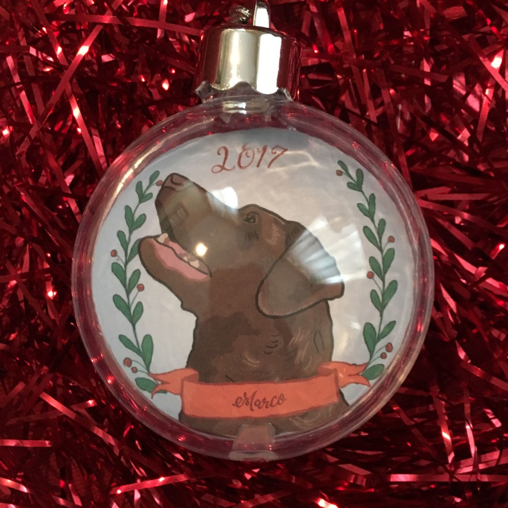 Holiday ornament with an illustrated portrait of a dog named Marco