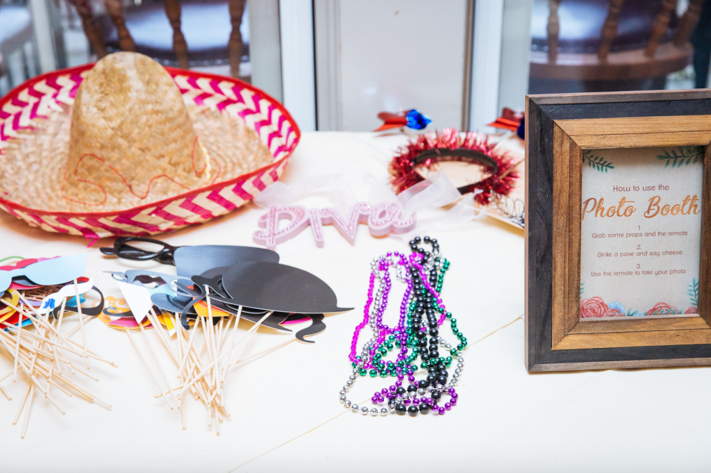Framed sign with instructions for using the photo booth.