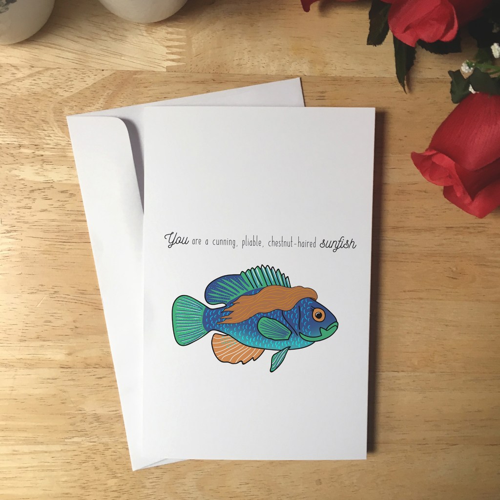 Greeting Card design with a sunfish that has long flowy brown hair. The text reads You are a cunning, pliable, chestnut-haired sunfish.