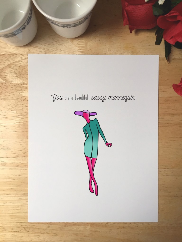 Print design with an illustrated pink mannequin wearing a purple floppy hat and green dress. The text reads You are a beautiful, sassy mannequin.