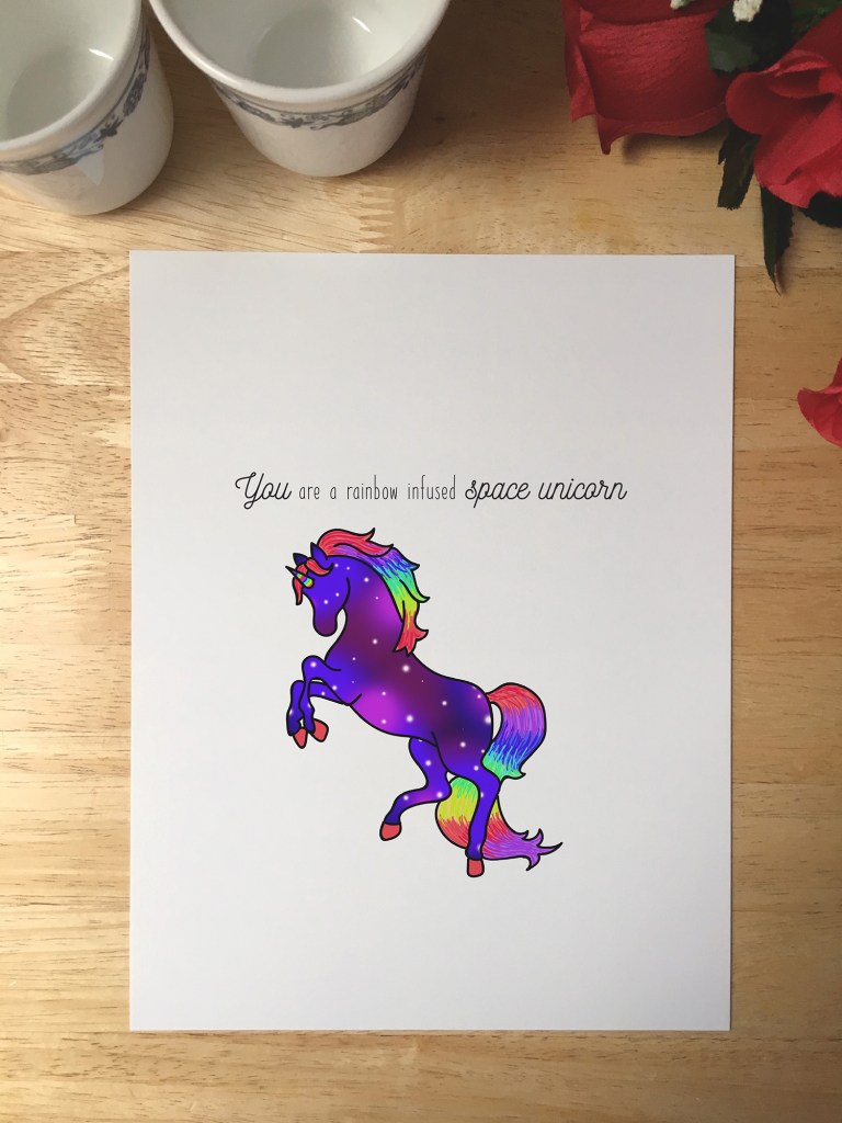 Print design with an illustration of a unicorn that has a galaxy pattern in its hair and a rainbow mane and tail. The text reads You are a rainbow infused space unicorn.