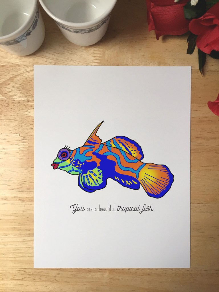 Print design with an illustration of a tropical fish that has red lipstick and eyelashes. The text reads You are a beautiful tropical fish.