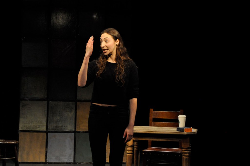 Arielle Beth Klein holding her hand up to her face staring at it with wide eyes in "My Shiksa Boyfriend". Photo by Lauren Bryant.